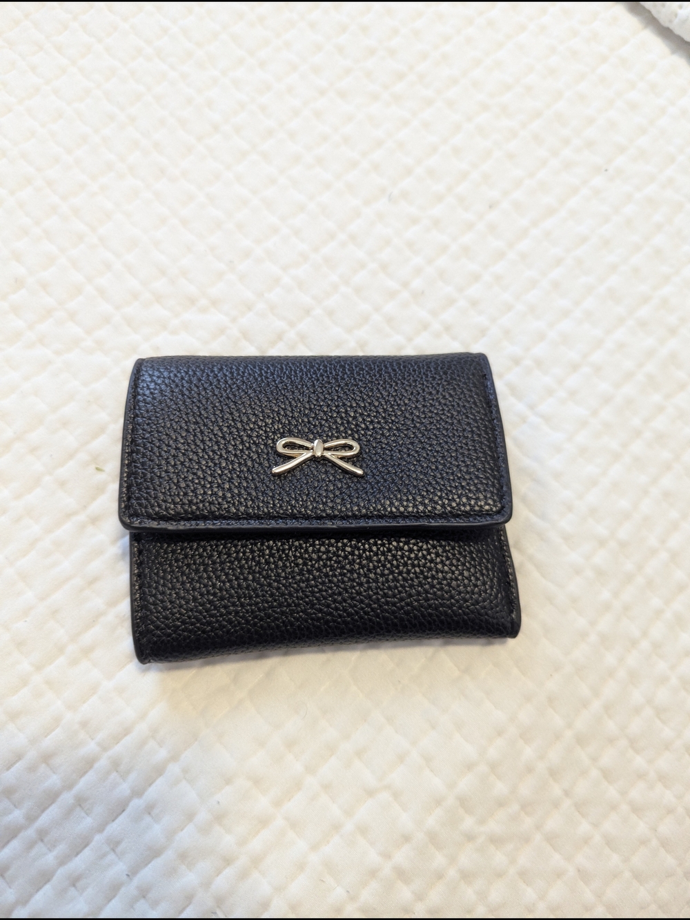 Black Pebbled Leather Wallet with Silver Bow Accent